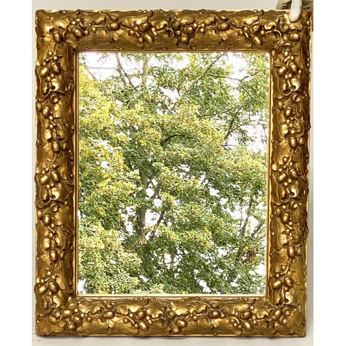 115 - WALL MIRROR, 19th century giltwood and composition, with carved oak leaf frame, 76cm x 63cm.