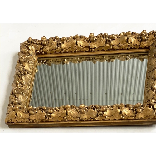 115 - WALL MIRROR, 19th century giltwood and composition, with carved oak leaf frame, 76cm x 63cm.