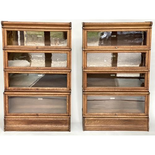 122 - GLOBE WERNICKE BOOKCASES, a pair, early 20th century oak each with four stacking glazed sections, wi... 