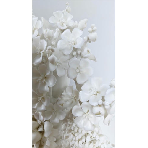 18 - BLANC DE CHINE PORCELAIN FLOWER DISPLAY, with an ebonised and glass case, 54cm H x 34cm x 24cm.