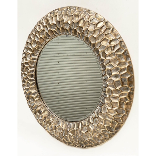 291 - CIRCULAR WALL MIRRORS, a pair, with 'hammered' cushion gilt metal frames, 73cm W. (2)