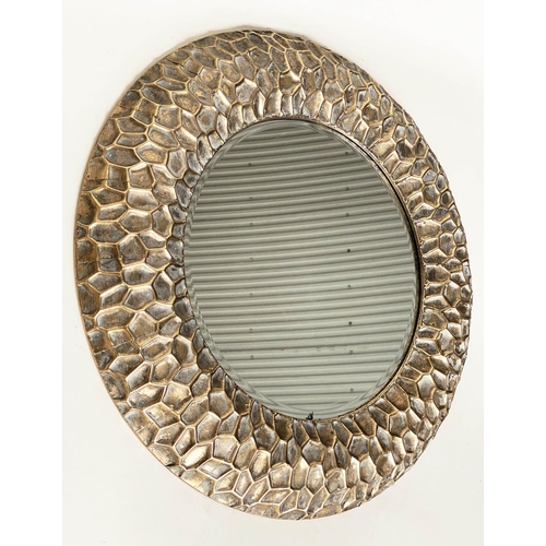 291 - CIRCULAR WALL MIRRORS, a pair, with 'hammered' cushion gilt metal frames, 73cm W. (2)