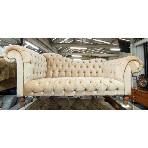 511 - SOFA, 178cm L x 83cm H with buttoned upholstery on short turned supports.