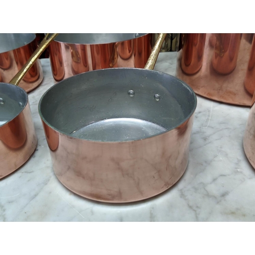 101 - BATTERIE DE CUISINE, comprising of a graduated set of five copper pans, the largest 20cm diam, anoth... 