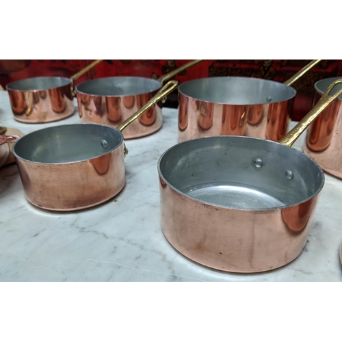 101 - BATTERIE DE CUISINE, comprising of a graduated set of five copper pans, the largest 20cm diam, anoth... 