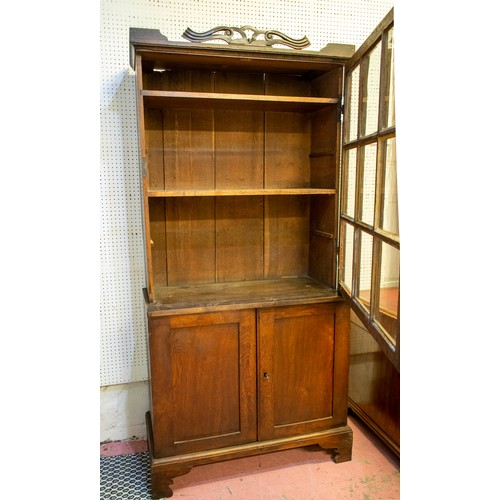 200 - BOOKCASE, 201cm H x 98cm x 42cm D, Georgian oak with glazed door, enclosing fixed shelves above two ... 