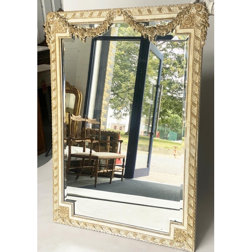 117 - WALL MIRROR, 19th century French giltwood and parcel gilt with bevelled mirror plate within a ribbon... 