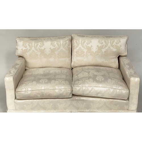 145 - SOFA, traditional two seater ivory brocade upholstered with down feather filled cushions, 135cm W.