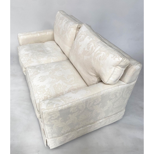 145 - SOFA, traditional two seater ivory brocade upholstered with down feather filled cushions, 135cm W.