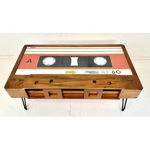 438 - LOW TABLE, 40cm high x 110cm wide x 60cm deep, cassette tape design, with storage to one side.