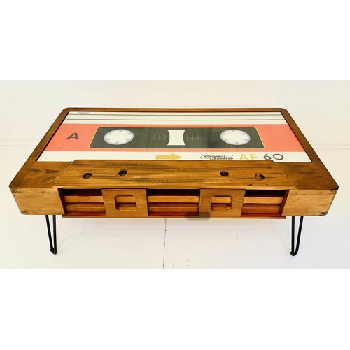 438 - LOW TABLE, 40cm high x 110cm wide x 60cm deep, cassette tape design, with storage to one side.