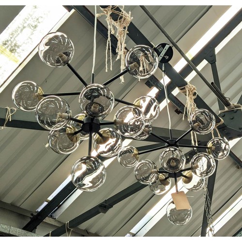 488 - CHANDELIERS, a pair, 1950s Italian style, each 11 branch, black painted metal frame with gilt detail... 