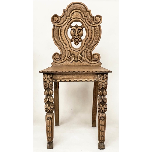 118 - HALL CHAIRS, a pair, 19th century Gothic oak each with carved and pierced lion mask backs, 43cm W. (... 