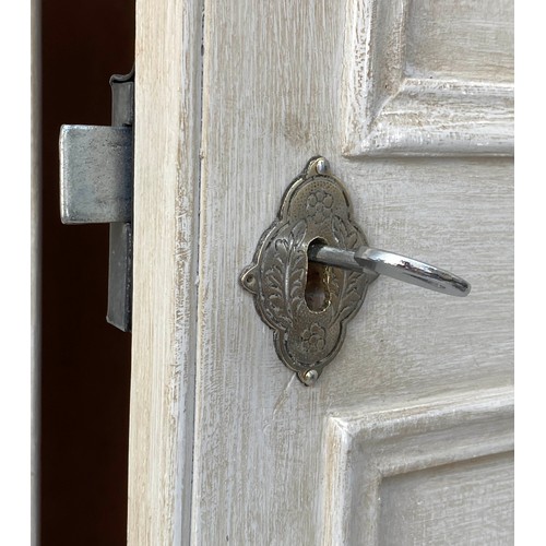 127 - ARMOIRE, French style traditionally grey painted with two panelled doors enclosing hanging space and... 