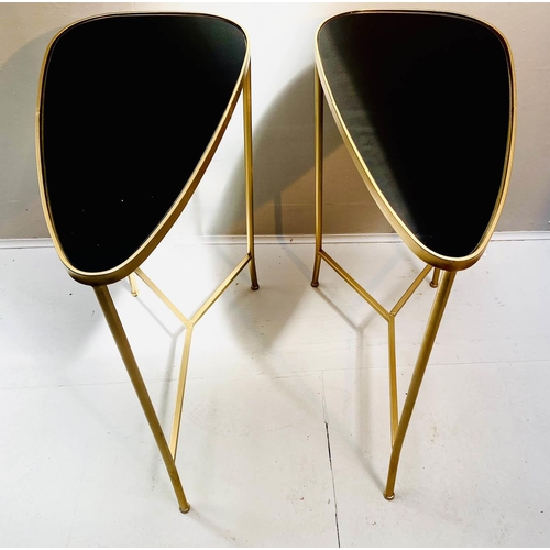 520 - SIDE TABLES, 55cm high, 55cm wide, 30cm deep, a pair, 1950s Italian style, gilt metal, black glass t... 