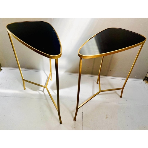 520 - SIDE TABLES, 55cm high, 55cm wide, 30cm deep, a pair, 1950s Italian style, gilt metal, black glass t... 