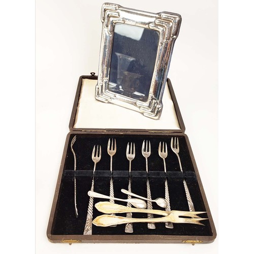 28 - COLLECTION OF ASSORTED SILVER AND PLATED WARE, comprising award trophies photo frames, cake forks, c... 