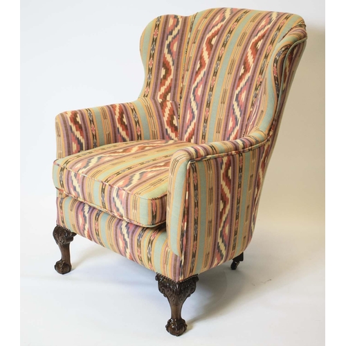 173 - WING ARMCHAIR, 103cm H x 73cm, Georgian revival in geometric upholstery on rear castors.