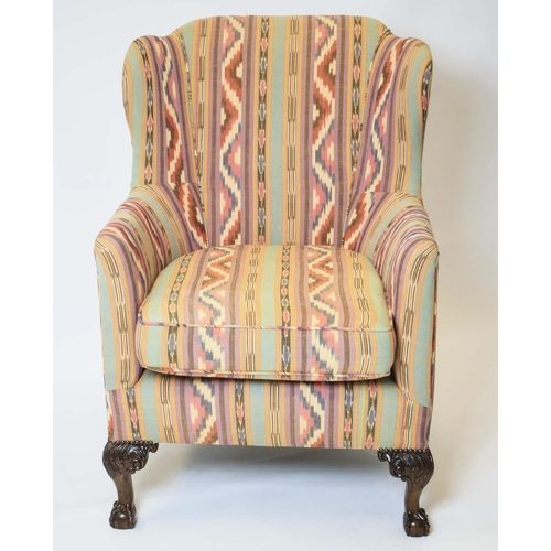 173 - WING ARMCHAIR, 103cm H x 73cm, Georgian revival in geometric upholstery on rear castors.