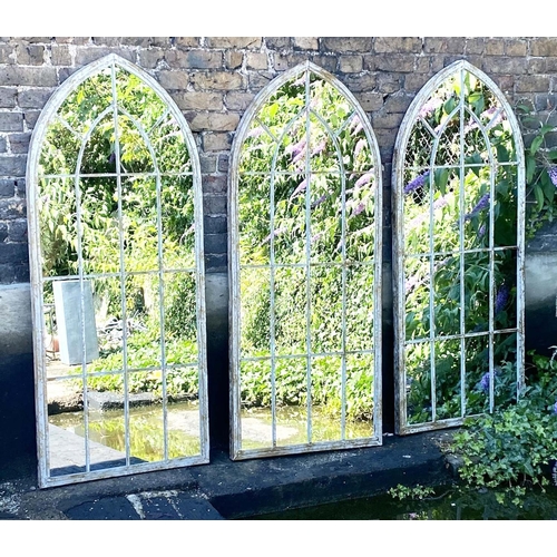 317 - ARCHITECTURAL WALL MIRRORS, 160cm high, 67cm wide, set of three, Gothic style arched design aged pai... 