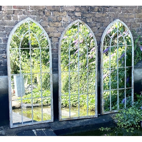 317 - ARCHITECTURAL WALL MIRRORS, 160cm high, 67cm wide, set of three, Gothic style arched design aged pai... 