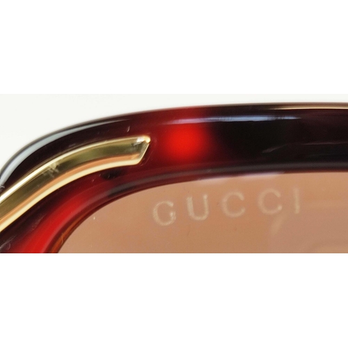 10 - GUCCI SUNGLASSES, square form, brown/gold with red and cream details, complete with case and pouch.