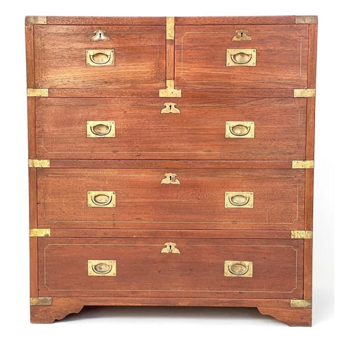 109 - CAMPAIGN STYLE CHEST, mid 20th century Indian, teak and brass bound with two short and three long dr... 