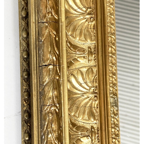 114 - WALL MIRROR, early 20th century giltwood and gesso rectangular with anthemion decorated framed.