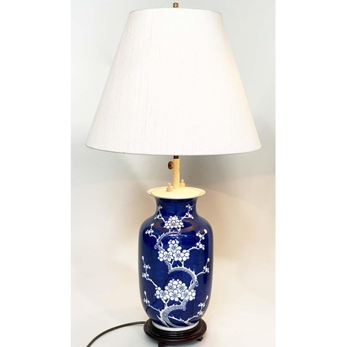 117 - TABLE LAMPS, a pair, Chinese white on deep blue ceramic, vase form, adjustable height with wooden ba... 