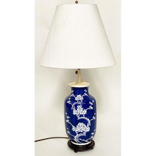 117 - TABLE LAMPS, a pair, Chinese white on deep blue ceramic, vase form, adjustable height with wooden ba... 