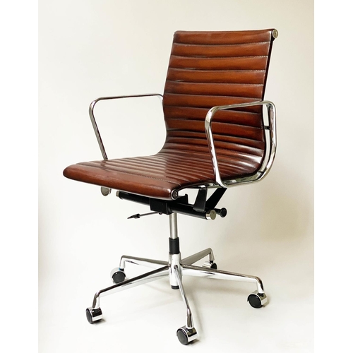 121 - REVOLVING DESK CHAIR, Charles and Ray Eames inspired with ribbed tan leather seat revolving and recl... 