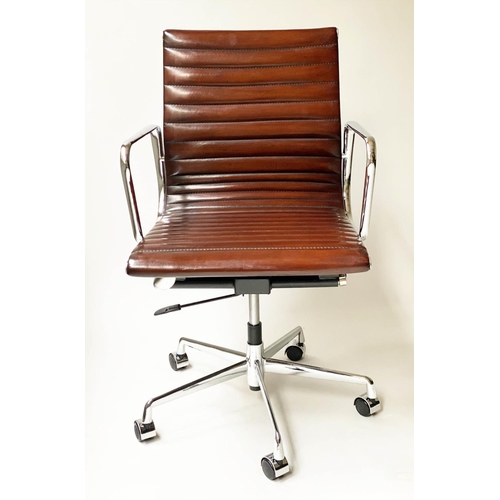 121 - REVOLVING DESK CHAIR, Charles and Ray Eames inspired with ribbed tan leather seat revolving and recl... 