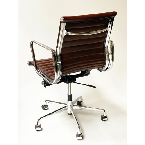 121 - REVOLVING DESK CHAIR, Charles and Ray Eames inspired with ribbed tan leather seat revolving and recl... 