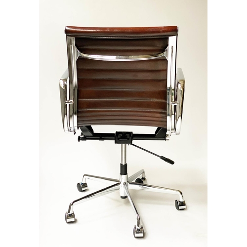 121 - REVOLVING DESK CHAIR, Charles and Ray Eames inspired with ribbed tan leather seat revolving and recl... 