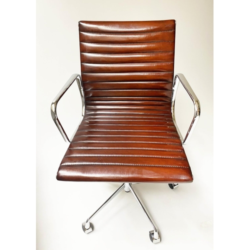 121 - REVOLVING DESK CHAIR, Charles and Ray Eames inspired with ribbed tan leather seat revolving and recl... 