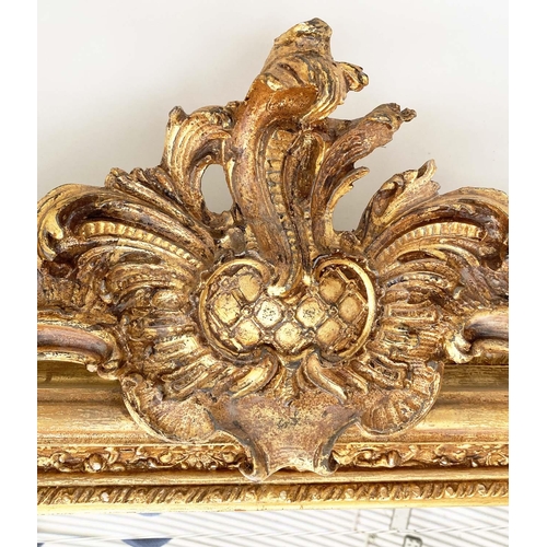 123 - OVERMANTEL MIRROR, French style gilded with arched bevelled mirror plate and foliate crest and frame... 