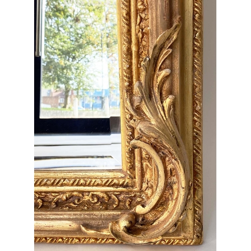 123 - OVERMANTEL MIRROR, French style gilded with arched bevelled mirror plate and foliate crest and frame... 