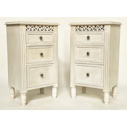 124 - BEDSIDE CHESTS, a pair, French style grey painted each with three drawers and pierced frieze, 40cm x... 