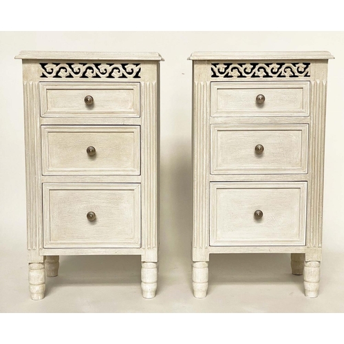 124 - BEDSIDE CHESTS, a pair, French style grey painted each with three drawers and pierced frieze, 40cm x... 