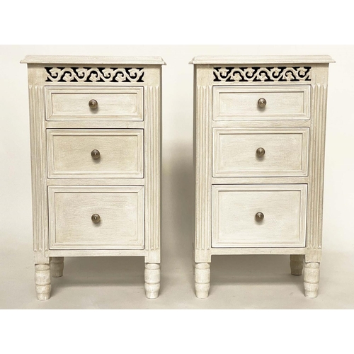 124 - BEDSIDE CHESTS, a pair, French style grey painted each with three drawers and pierced frieze, 40cm x... 