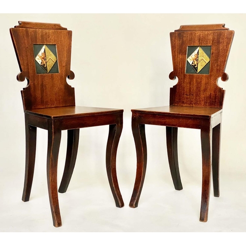 128 - HALL CHAIRS, a pair, Regency mahogany each heraldic panelled back and sabre front supports, 39cm W. ... 