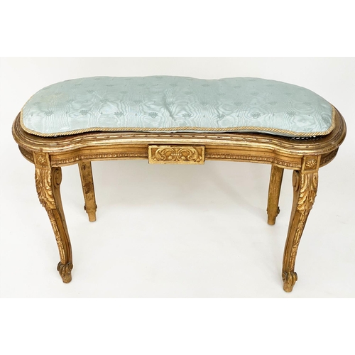 130 - WINDOW SEAT, early 20th century French transitional style giltwood of kidney form with cane seat and... 