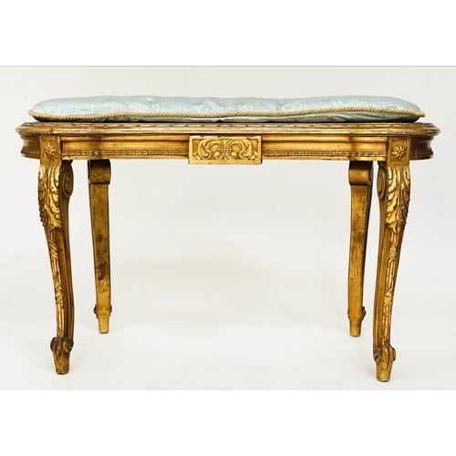 130 - WINDOW SEAT, early 20th century French transitional style giltwood of kidney form with cane seat and... 