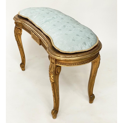 130 - WINDOW SEAT, early 20th century French transitional style giltwood of kidney form with cane seat and... 