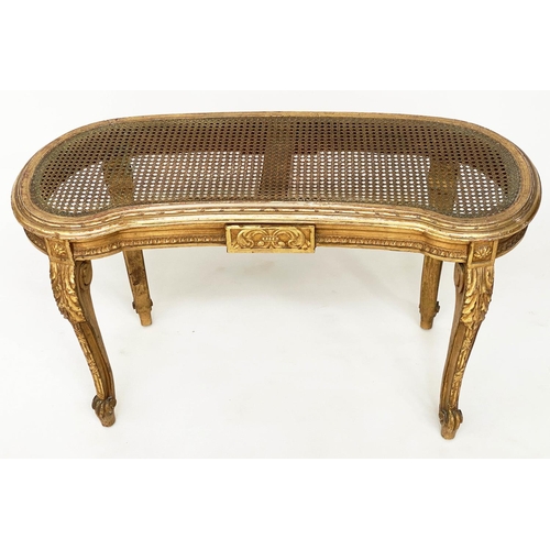 130 - WINDOW SEAT, early 20th century French transitional style giltwood of kidney form with cane seat and... 