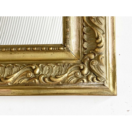 134 - WALL MIRROR, early 20th century French Art Nouveau/Belle Epoque giltwood and gesso with foliate cres... 