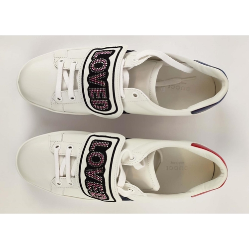 17 - GUCCI TRAINERS, with 'Loved' imprinted on removable strap, with box, size 39 1/2.