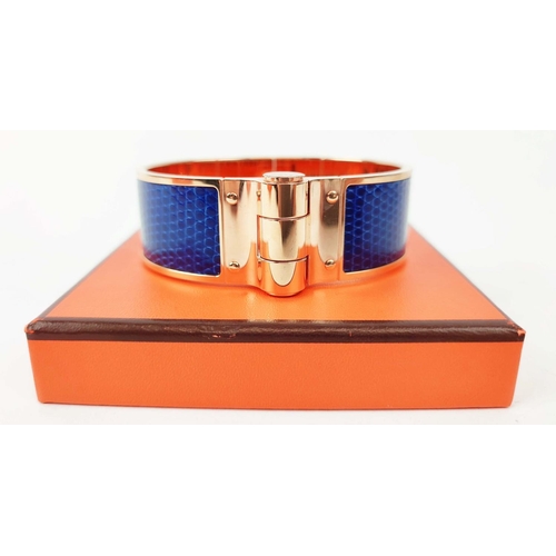 21 - HERMÈS BRACELET ARTICULÉ, gold plated with bleu lizard leather insert, 2,01cm W x 6,3cm x 4,6cm, wit... 