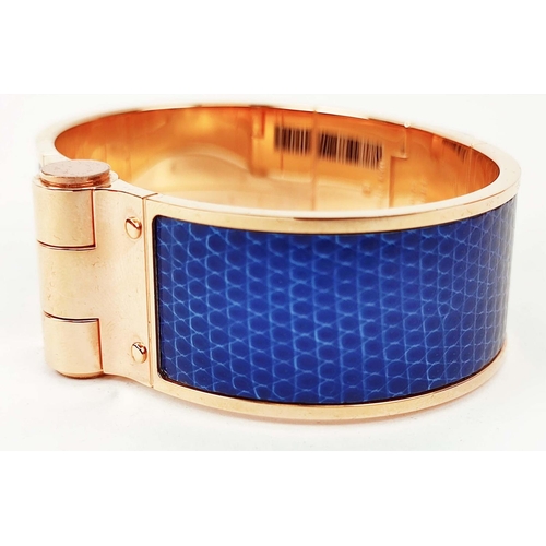 21 - HERMÈS BRACELET ARTICULÉ, gold plated with bleu lizard leather insert, 2,01cm W x 6,3cm x 4,6cm, wit... 