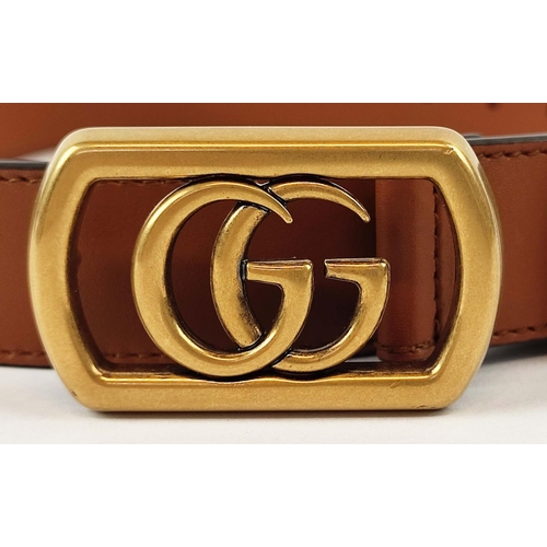 24 - GUCCI UNISEX FRAMED GG LOGO MARMONT BELT, framed GG logo on brass buckle with brown leather, size 10... 